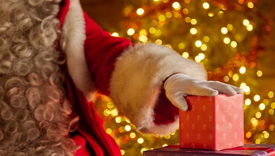 Santa Holding a Gift